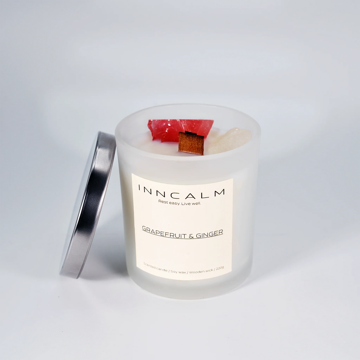Luxury Grapefruit & Ginger scented candle with a protective lid, keeping the vibrant citrus and spicy ginger fragrance fresh