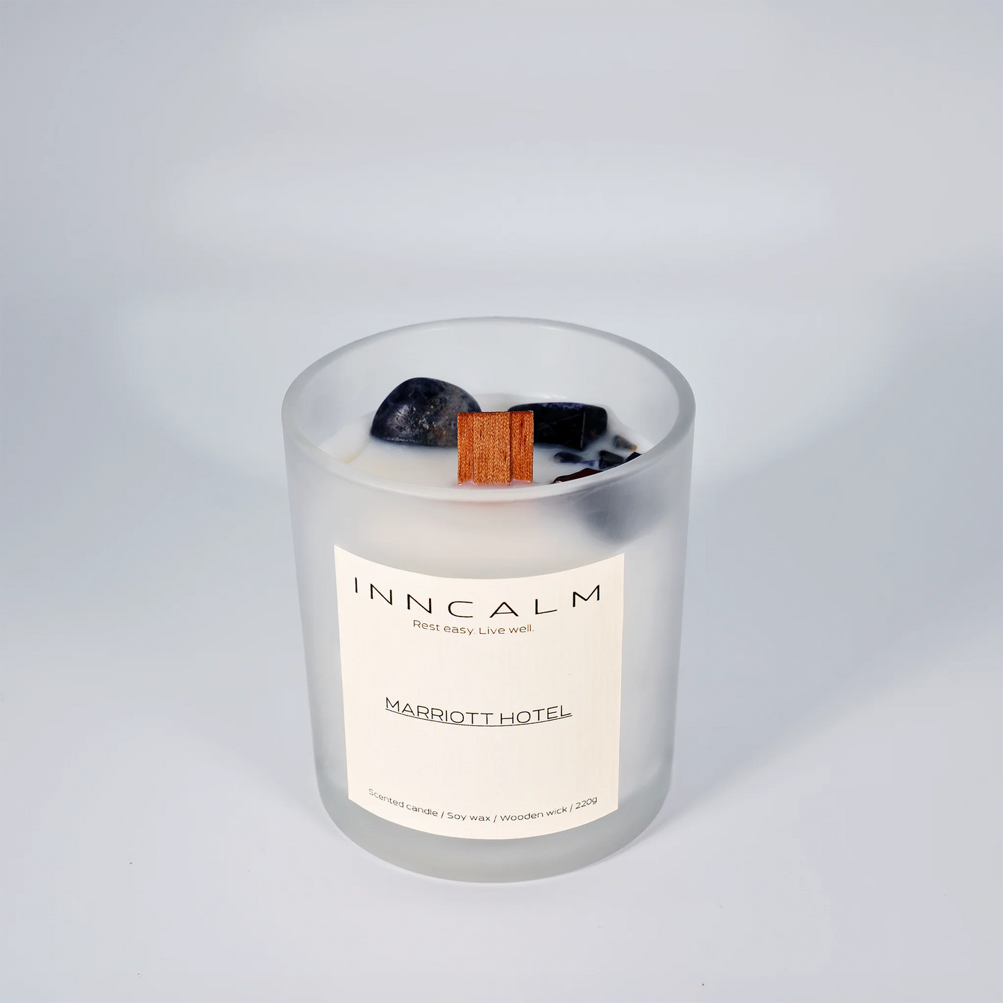 hotel-inspired scented candle made with soy wax and a wooden wick, filling the room with an exclusive spa-like ambiance.