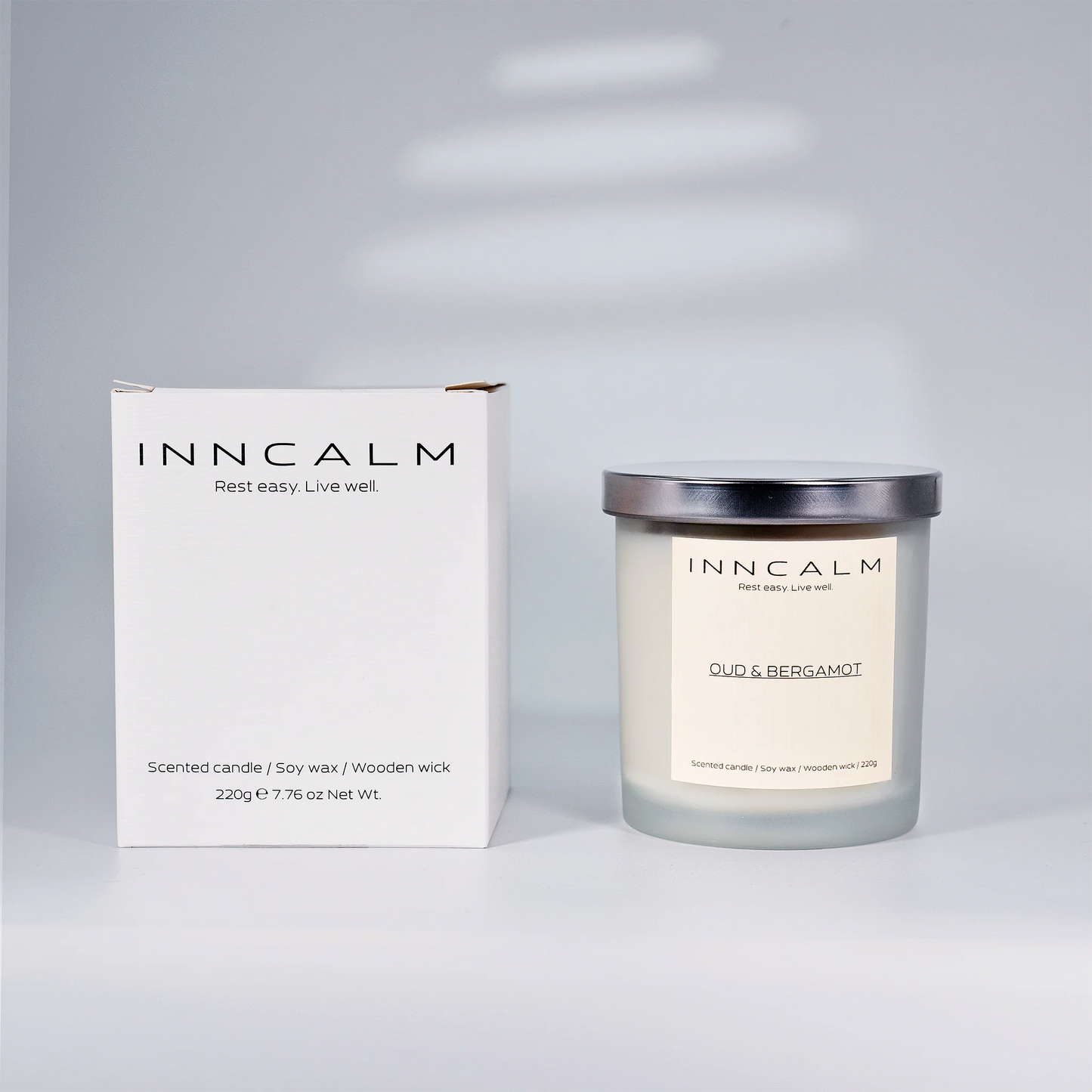 eco-friendly packaging for the Oud & Bergamot scented candle, a perfect gift for those who appreciate bold fragrances.