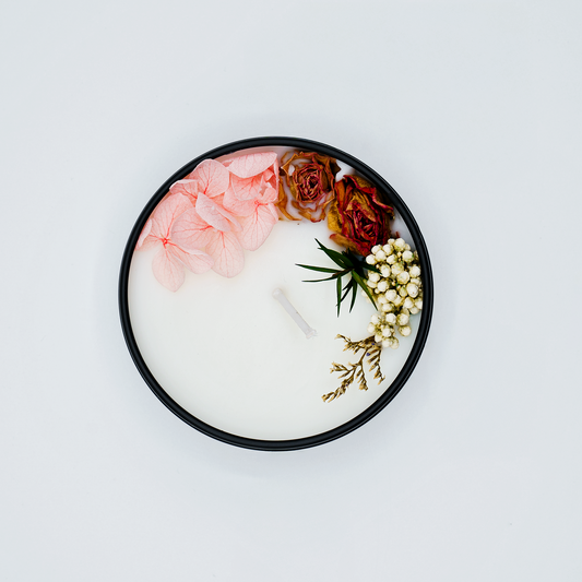 Top view of Spirit Refresh scented candle with floral decorations, adding elegance to home decor and relaxation spaces.