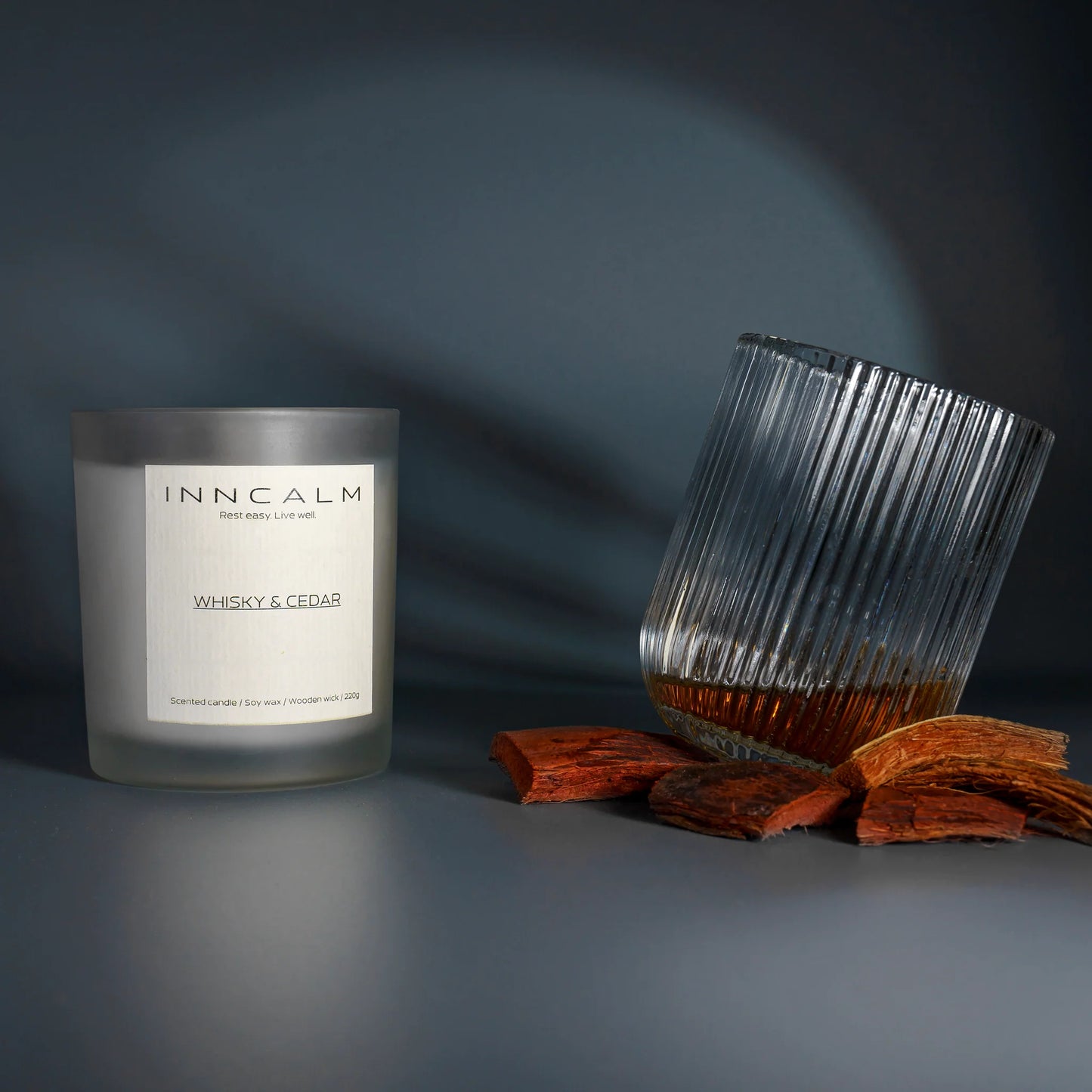 Luxury Whiskey & Cedar scented candle in a premium glass jar, made with natural soy wax, a wooden wick and crystal decoration