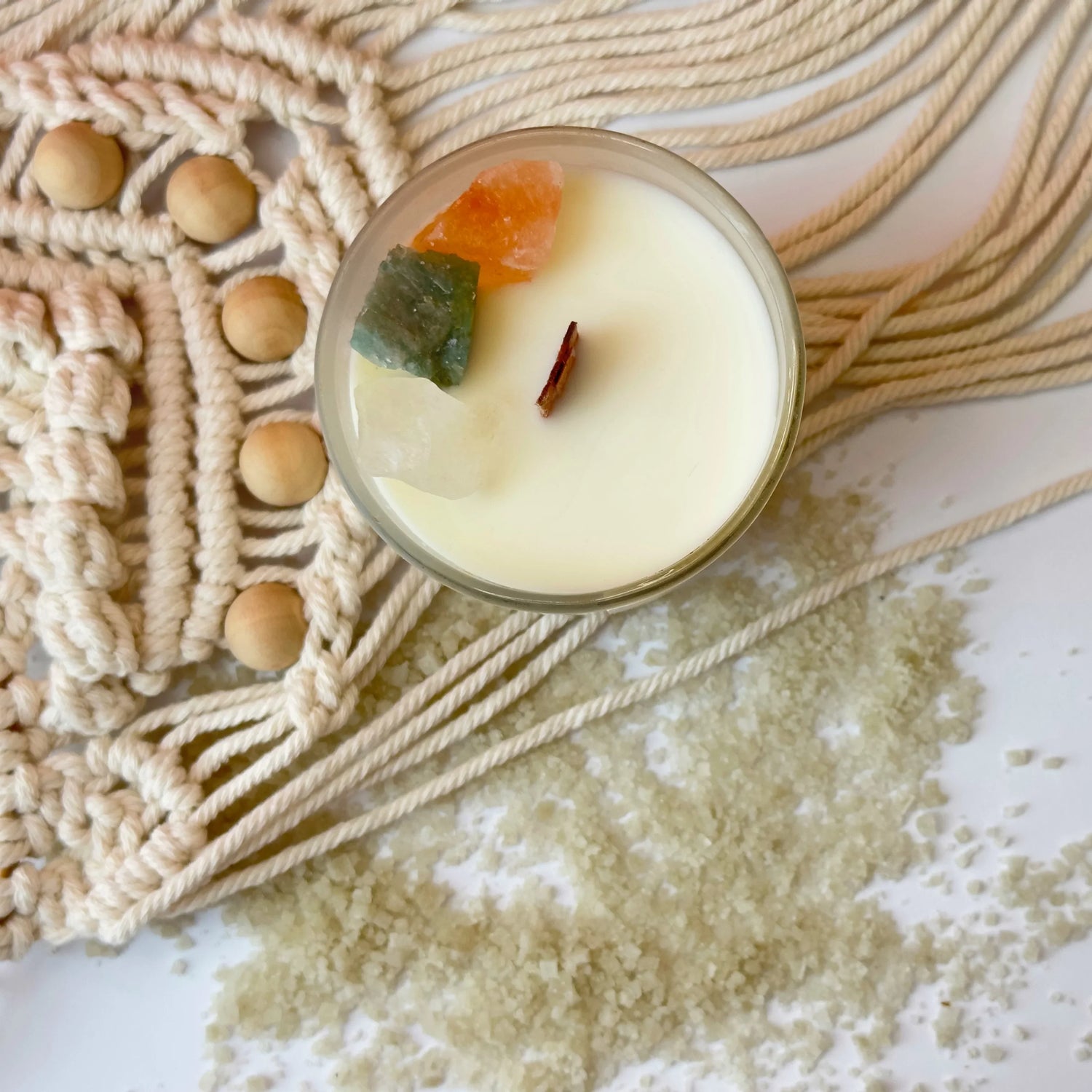 Luxury scented candles in glass jars with wooden wicks and crystal decorations, perfect for a cozy and elegant ambiance.