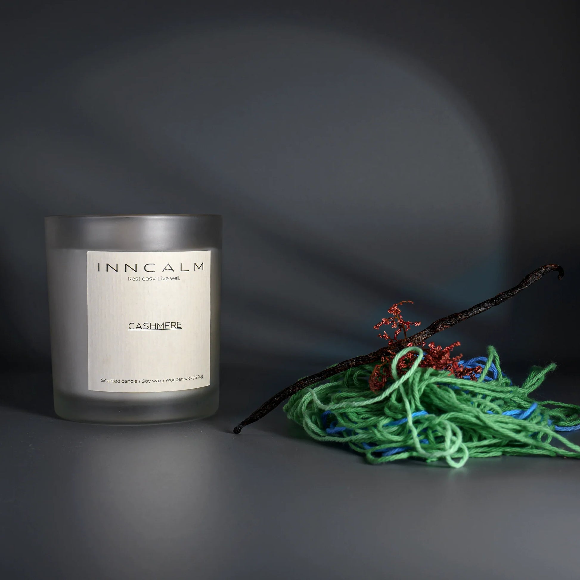 Cashmere scented candle in a glass jar, cozy fragrance with hints of vanilla, musk, and amber, made with natural soy wax.