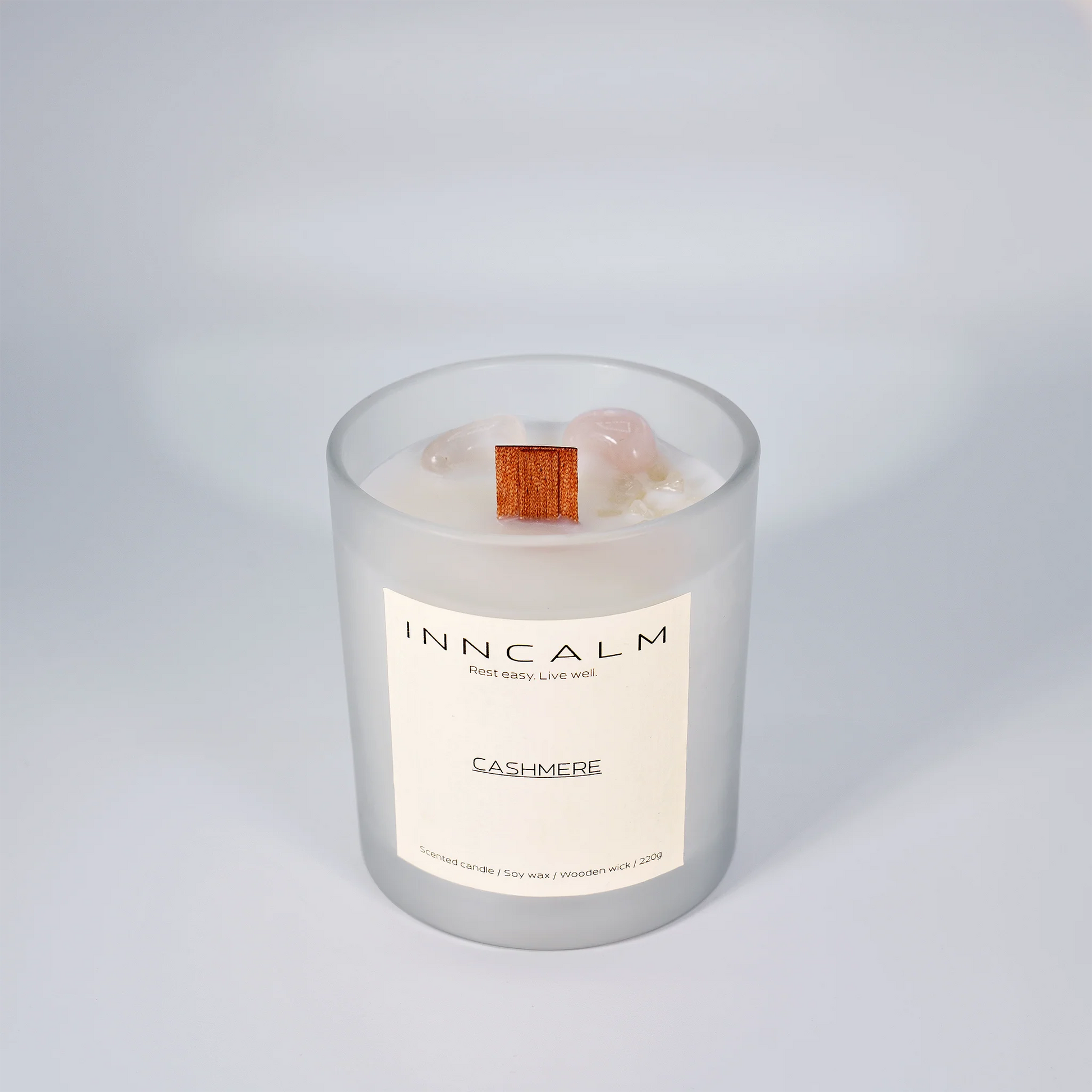 INNCALM Cashmere luxury candle, evoking warmth and comfort with a delicate, powdery aroma, featuring a wooden wick.