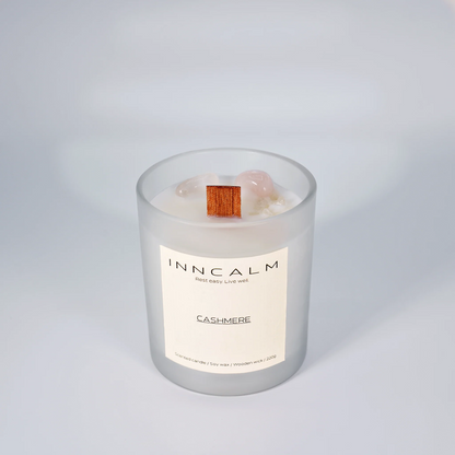 INNCALM Cashmere luxury candle, evoking warmth and comfort with a delicate, powdery aroma, featuring a wooden wick.