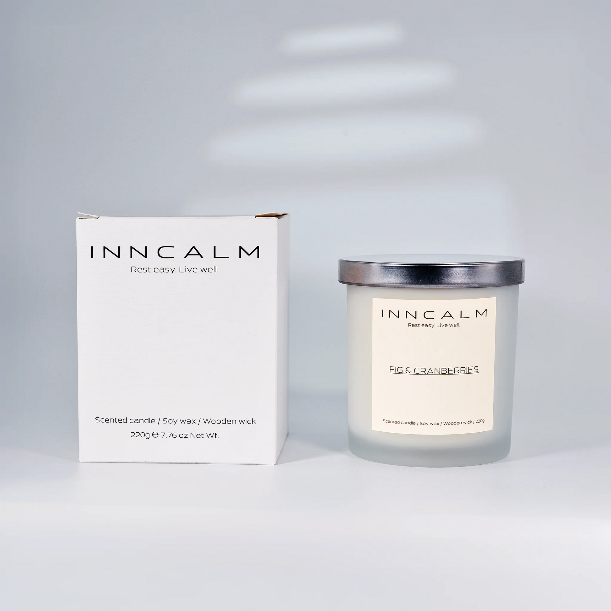 Premium packaging for the INNCALM Fig & Cranberries scented candle, a luxurious home fragrance gift for any occasion.