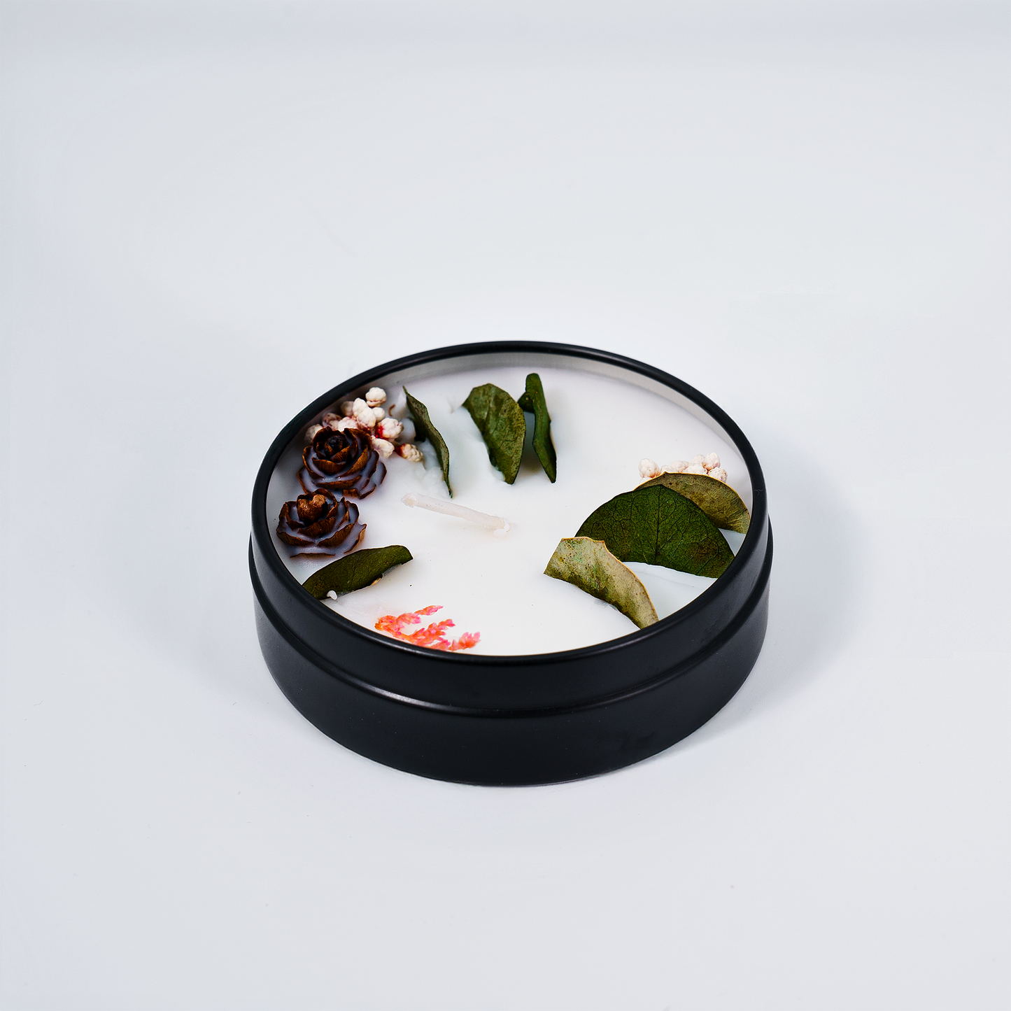 Good Night scented candle in a tin – top view of the natural soy wax candle with floral decorations for a peaceful ambiance.
