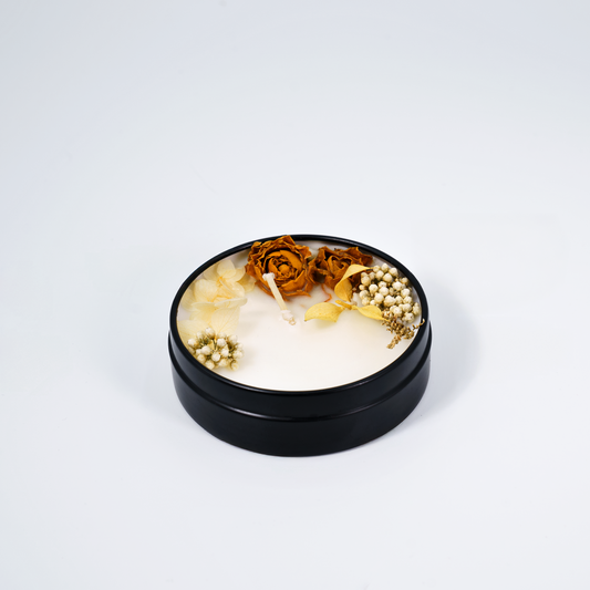 Immunity Boost scented candle in a tin – top view of the clean-burning soy wax candle with delicate floral decorations.