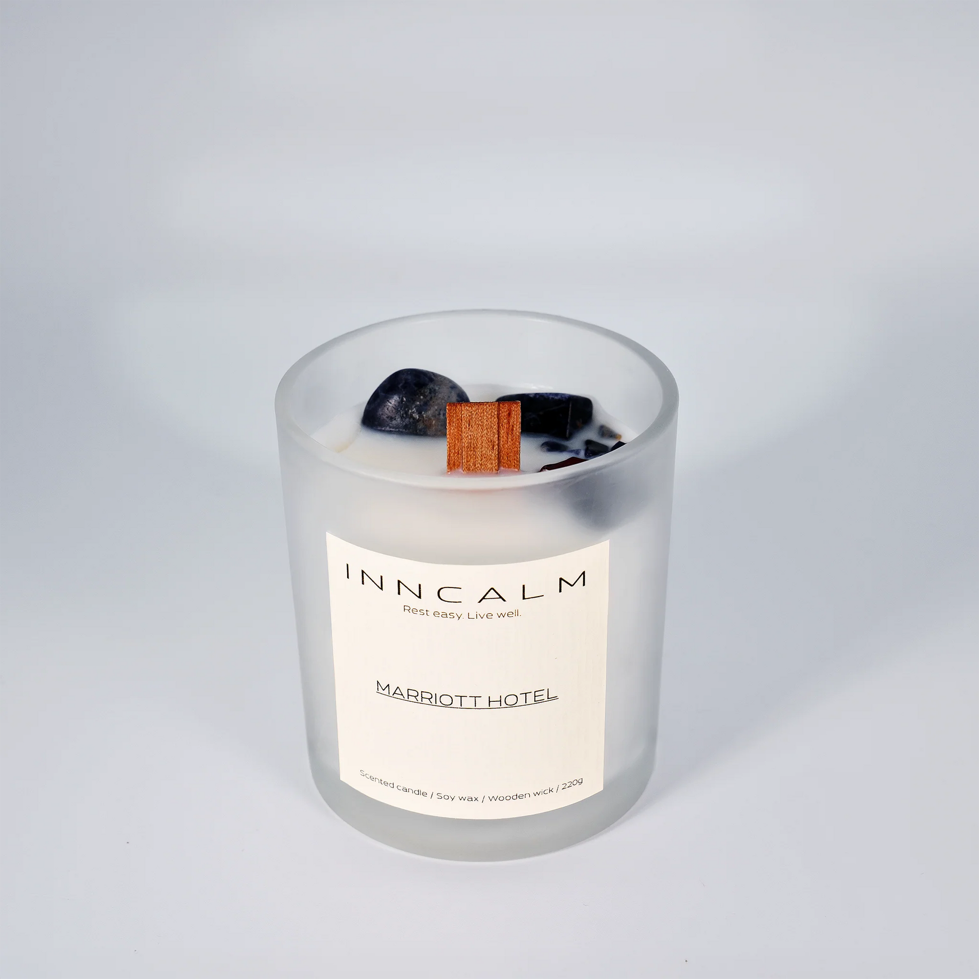 hotel-inspired scented candle made with soy wax and a wooden wick, filling the room with an exclusive spa-like ambiance.