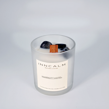 hotel-inspired scented candle made with soy wax and a wooden wick, filling the room with an exclusive spa-like ambiance.