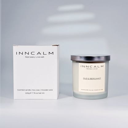 eco-friendly packaging for the Oud & Bergamot scented candle, a perfect gift for those who appreciate bold fragrances.