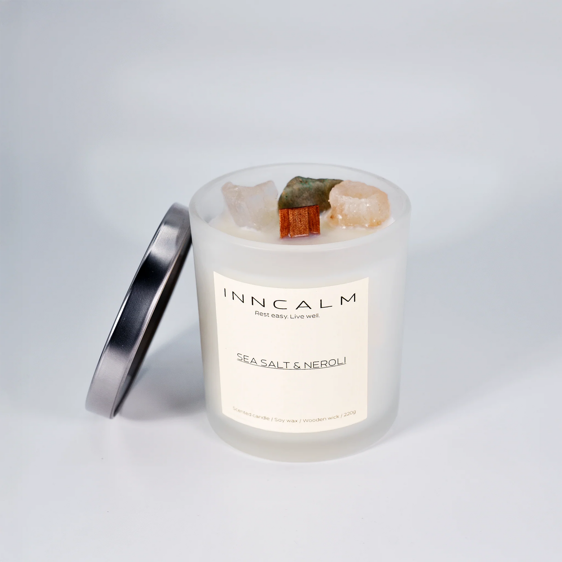 Premium Sea Salta & Neroli scented candle with a glass lid to preserve the refreshing aroma of neroli blossoms and sea salt