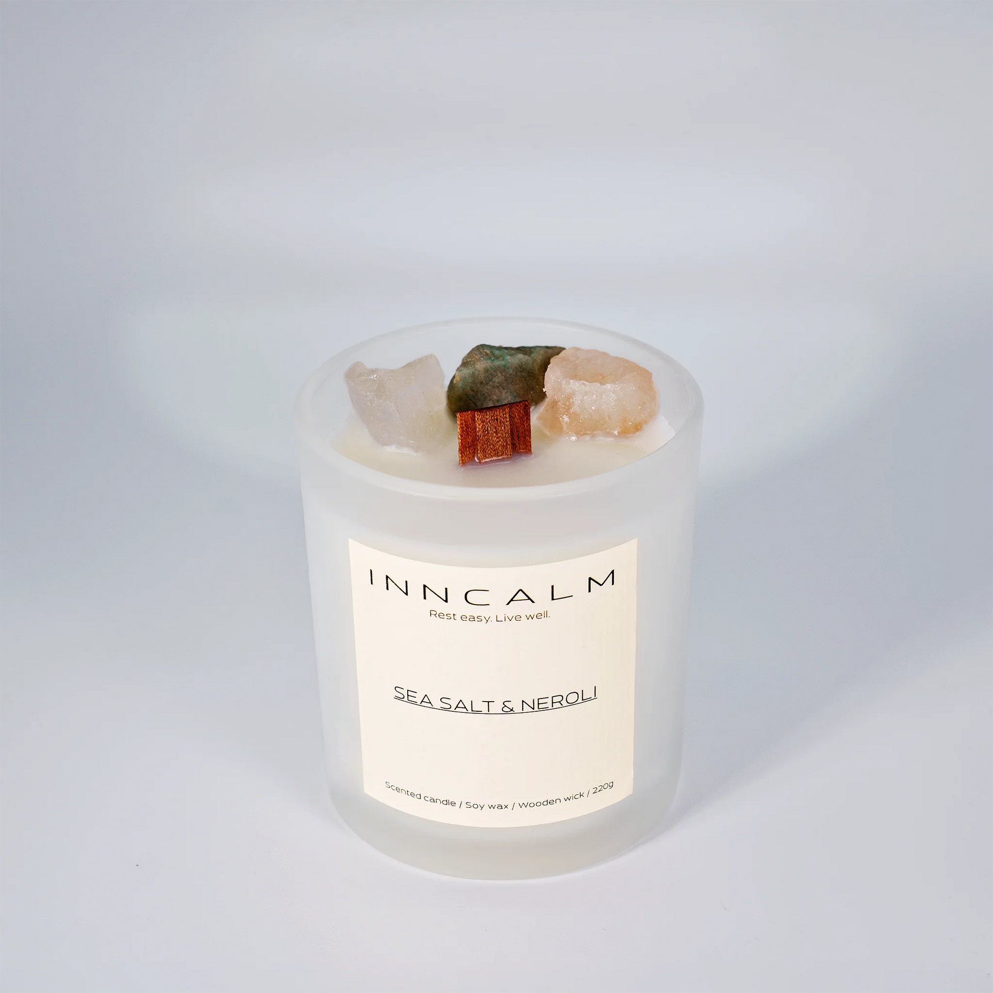 INNCALM Sea Salt & Neroli luxury candle, a coastal home fragrance with a calming, fresh scent, featuring a wooden wick.